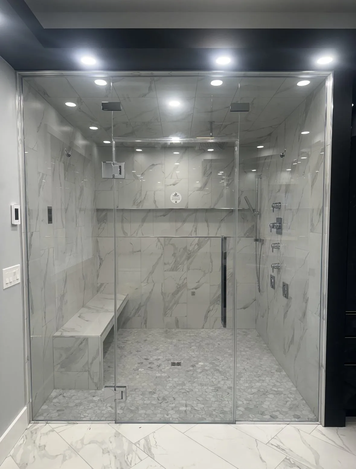 Rebuilt main bathroom with tile floor to ceiling and glass Walk In shower