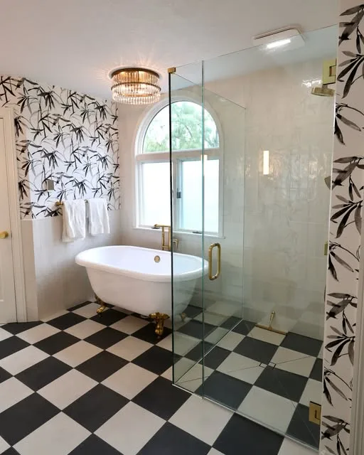 Master bathroom with black and white checkered floor and freestanding tub