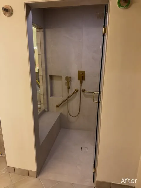Tiled shower with bench and grab bar