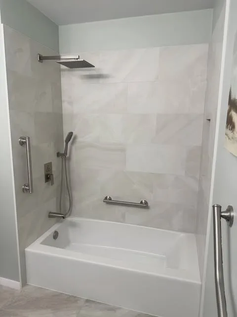 Bathtub with safety grab bars