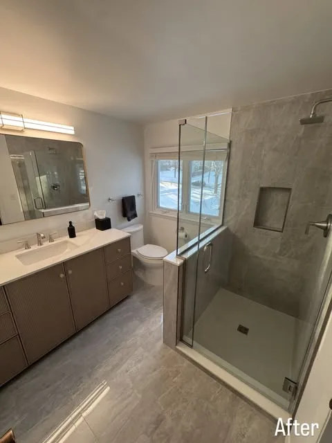 New vanity beside a glass Walk In shower